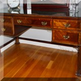 F26. Chippendale style desk with glass top. Some minor chips on edge. 32”h x 57”w x 28”d - $250 
